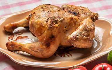 Roasted chicken with crisp on a plate
