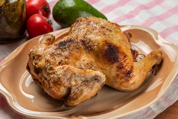 Roasted chicken with crisp on a plate