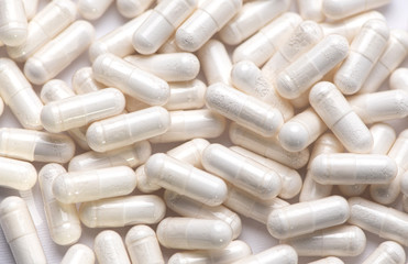 white pills with white powder close-up top view