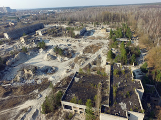 Fototapeta premium Drone quadrocopter explores an abandoned industrial complex.Kiev Region