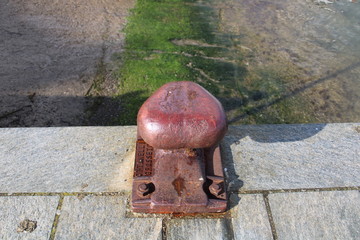 A fire hydrant on the side of a building