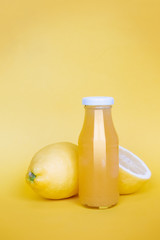 Concept of strengthening the immune system and protecting against viruses and infections. Bottle with lemon juice