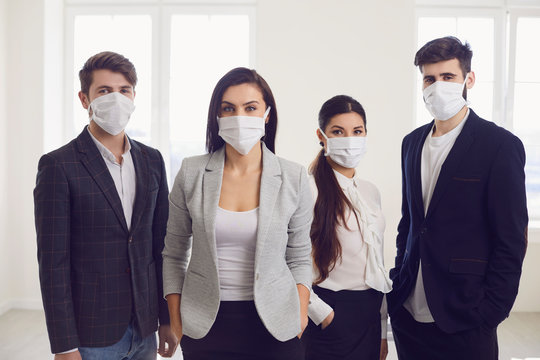 Danger Of Infection Of The Virus Coronavirus Infection. Group People Businesspeople In Medical Mask At Office.