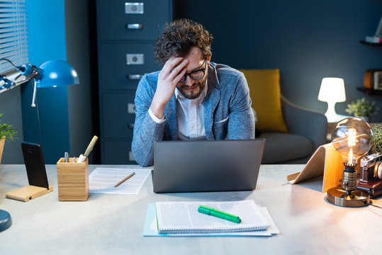 Stressed businessman working in the office