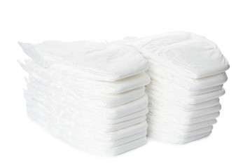 Stacks of baby diapers isolated on white
