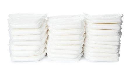 Stacks of baby diapers isolated on white