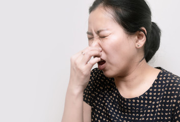 Portrait of Asian woman sneezing from VIRUS COVID-19 or epidemic disease. Health promotion concept.