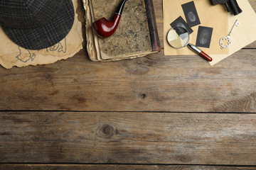 Composition with different vintage items on wooden background, space for text. Detective layout