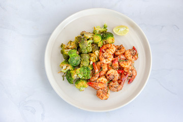 Baked Shrimp and Broccoli in a Packet with Lemon Top View, Flat Lay Food Stock Photo.