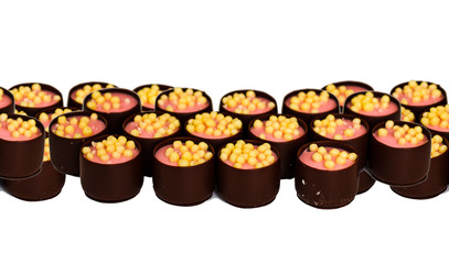 seamless horizontal banner of chocolate sweets with filling isolated on white background