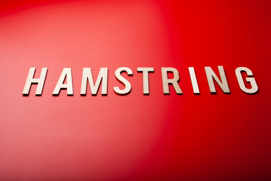 hamstring norwegian word text wooden letter on red background coronavirus covid-19