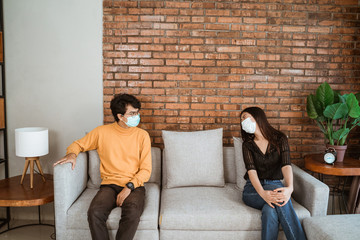 social distancing during virus pandemic. people wearing face masks avoid getting sick