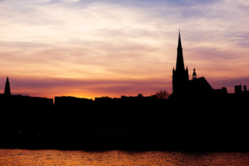 Evening cityscape of the Odra waterfront in Szczecin.