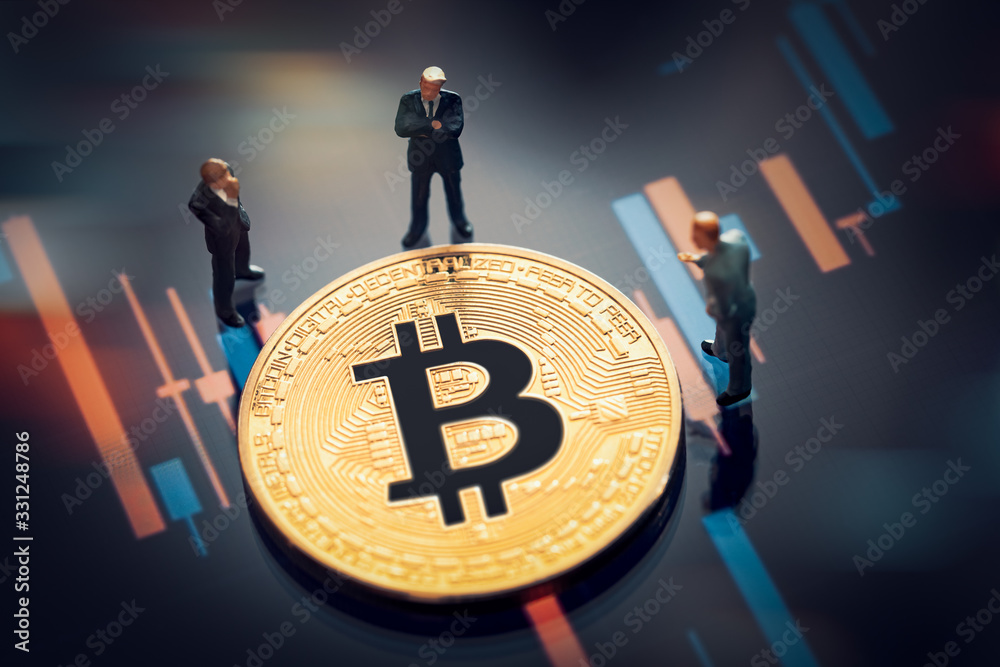 Wall mural business meeting about the investment decision for bitcoin concept: macro miniature businessman figu