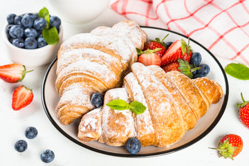 Croissant with chocolate and fresh berries.