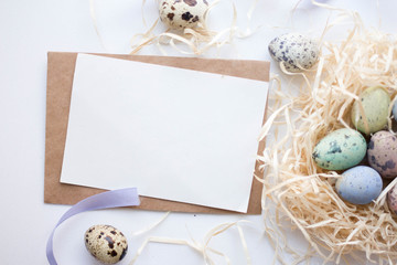 easter eggs, ribbons and nest on white background mockup card with plants. invitation card with environment and details Mockup with postcard and easter eggs on white 