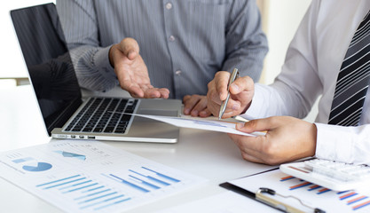 Business team meeting analyze financial graphs market growth reports And corporate income tax,...