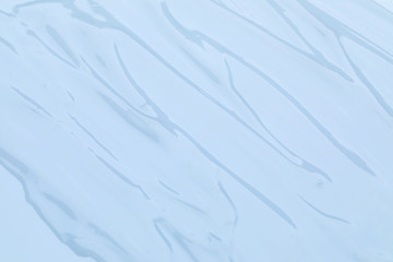 Obraz premium Sample of transparent cosmetic gel as background, closeup