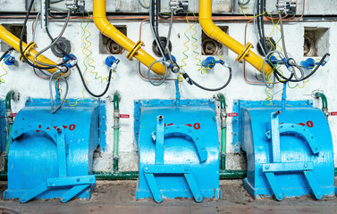 Gas burners on a hot water boiler in a gas boiler house. Gas boiler house equipment. .