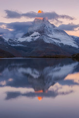 Matterhorn, amazing colors at sunrise, Mountain reflection in lake, scenic landscape.