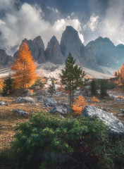 Geisler mountain peaks in misty autumn morning. Dolomites, Alps, Italy