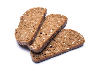 three sliced black farm bread with sunflower seeds on a white background