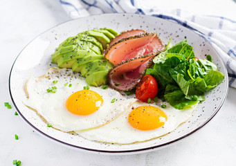 Ketogenic/paleo diet. Fried eggs, ham, avocado and fresh salad.  Keto breakfast. Brunch.