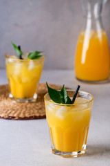 Tasty and Refreshing Orange Juice in Glass with Black Straws on Light Gray Background Fresh Ripe Oranges