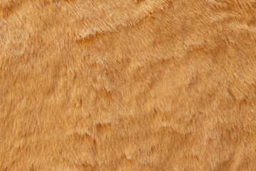 Brown real wool with a dark top texture background, orange natural wool,  fluffy fur texture for designers, close-up  wool rug