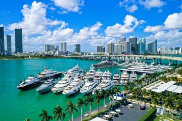 Aerial Photography of Luxury Boats and Buildings in the Background