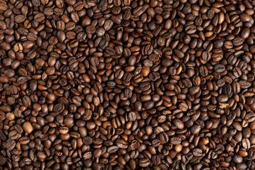  background texture of coffee beans top view. copyspace