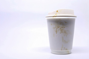 dirty brown stain on take away cup for hot coffee drink, paper mug on white background