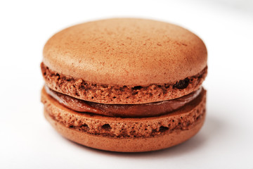 Chocolate macaroni cookies on a white background with brown filling, isolated.