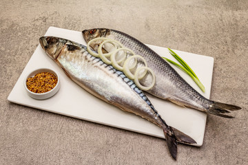 Pickled whole mackerel and herring. Traditional seafood delicacy, healthy eating concept