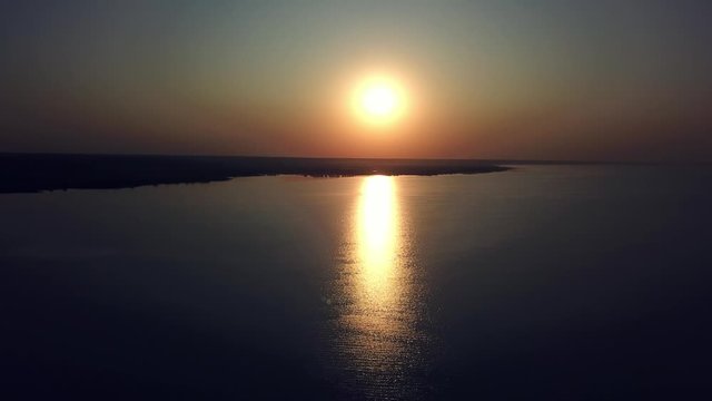 aerial view of sunset over sea, Beautiful sunrise Ocean, evening wawes on the sea, Beautiful reflections on water surface at sunset