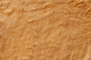 Brown real wool with a dark top texture background, orange natural wool,  fluffy fur texture for designers, close-up  wool rug