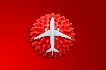 Obraz premium Danger of spread of infection coronavirus covid-19. Symbol of virus and aircraft, pandemic, closing borders, preventing the spread SARS-CoV-2 quarantine.