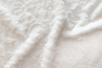 White real wool with a white top texture background, light natural sheep  wool, white seamless cotton, fluffy fur texture for designers, close-up white wool rug