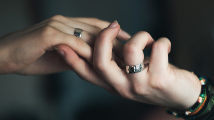 people, homosexuality, same-sex marriage and love concept - close up of happy lesbian couple hands