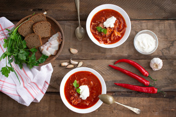 Red borsch. Ukrainian food. Rustic style. Red beetroot soup with beetroot, served with sour cream and garlic.