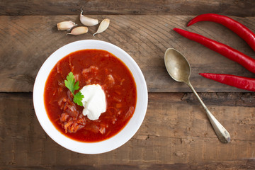 Red borsch. Ukrainian food. Rustic style. Red beetroot soup with beetroot, served with sour cream and garlic.