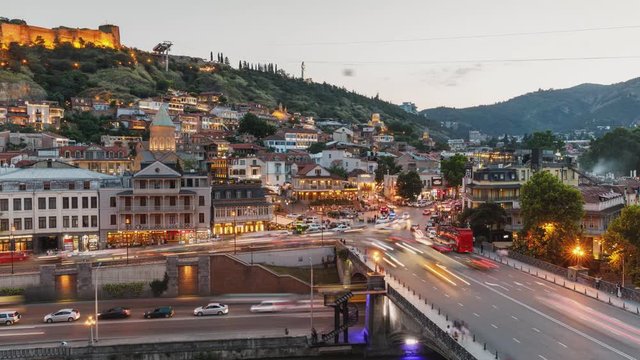Timelapse view of the Tbilisi city center, Metekhi Bridge and Narikala Fortress, Georgia.
