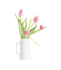pink tulips in white ceramic jug isolated on white background