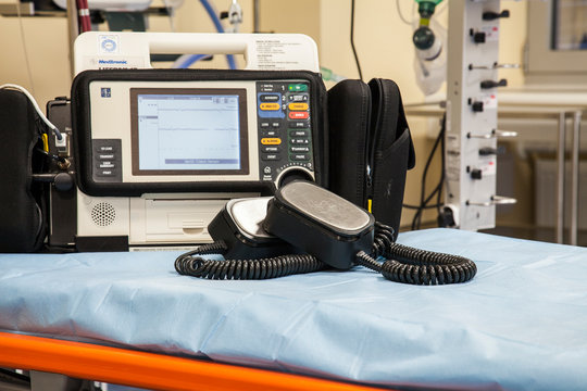 Defibrillator on bed in emergency ambulance station
