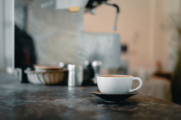 White Coffee cup on cement table in kitchen