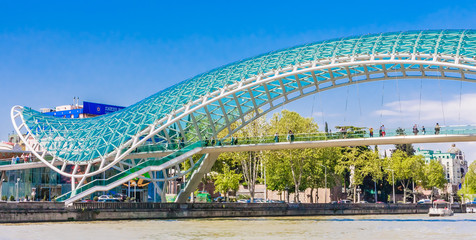 Tbilisi, Georgia. Bridge of Peace over the Kura River - obrazy, fototapety, plakaty