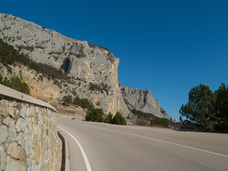 Highway in mountains on a bright sunny day.