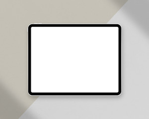 Tablet mockup on minimal background. Modern tablet with blank white screen. Photo mockup with...