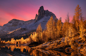 Majestic sunset of the mountains landscape. Wonderful Nature landscape during sunset. Beautiful colored trees over the Federa lake, glowing in sunlight. wonderful picturesque scene. color in nature