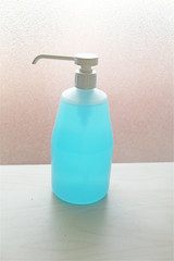 Isolated bottle dispenser of alcohol gel hand sanitizer to disinfect hands against bacteria and virus